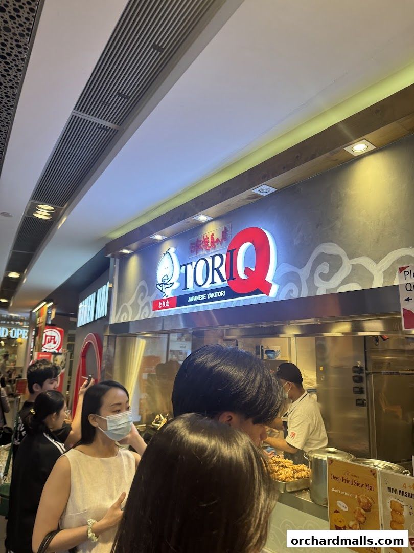 Customers queue at TORI-Q Japanese Yakitori stall in a mall.