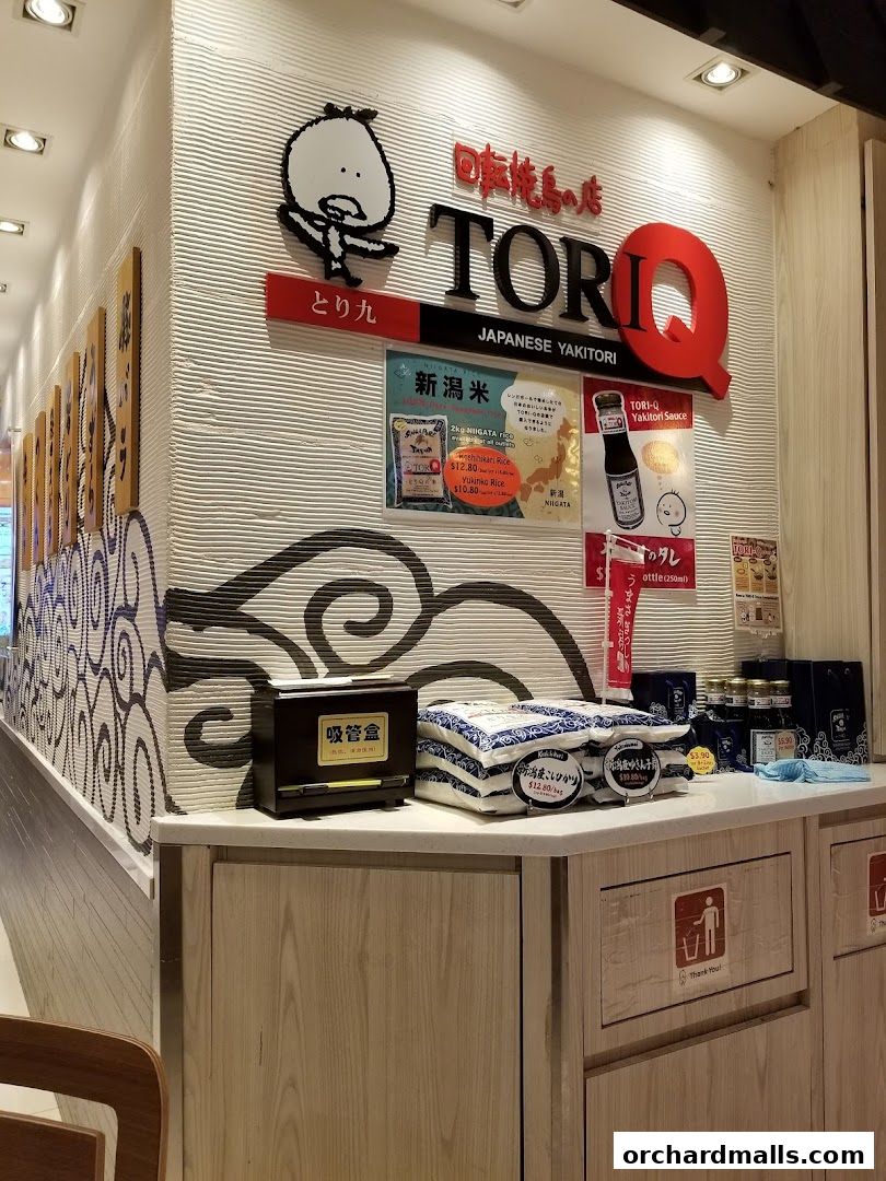 The TORI-Q Japanese Yakitori shop front displays its logo, rice products, and yakitori sauce.