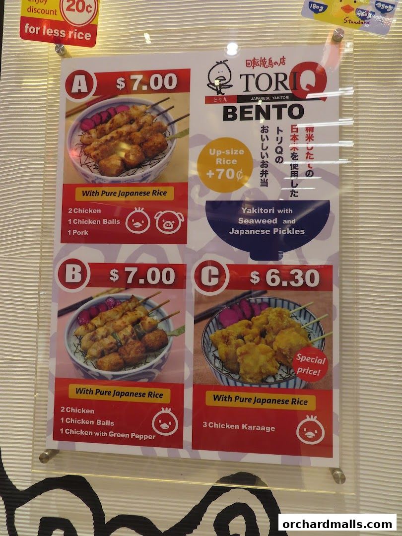 A menu board displaying three bento box options with prices and ingredients.