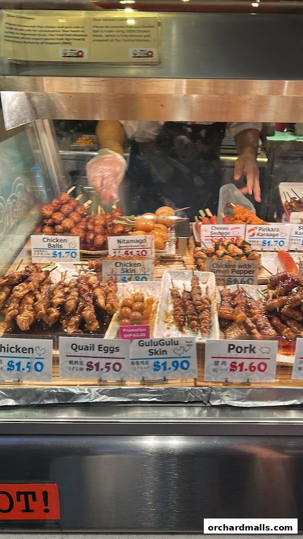 A display of various grilled skewers and snacks at TORI-Q ION Orchard.
