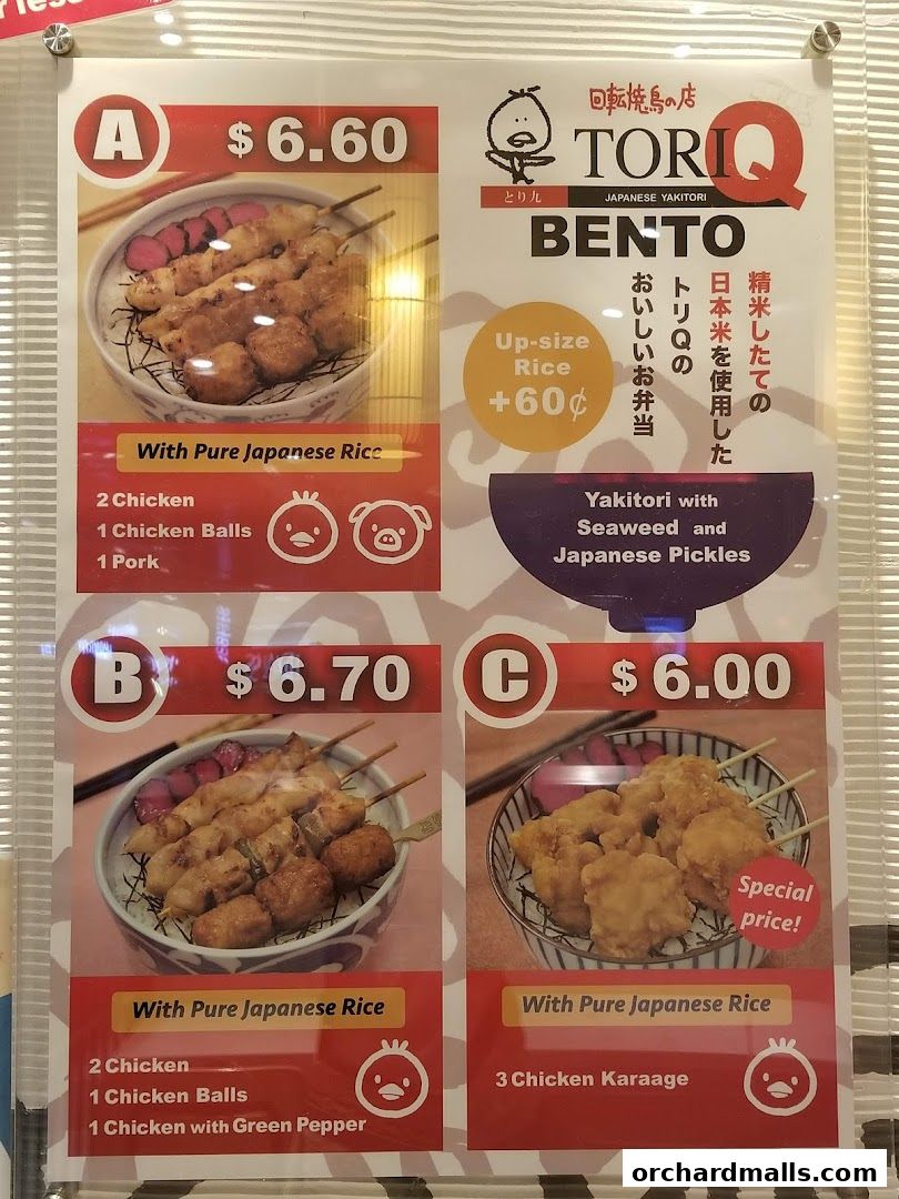 A menu board displaying three bento box options with yakitori and rice.