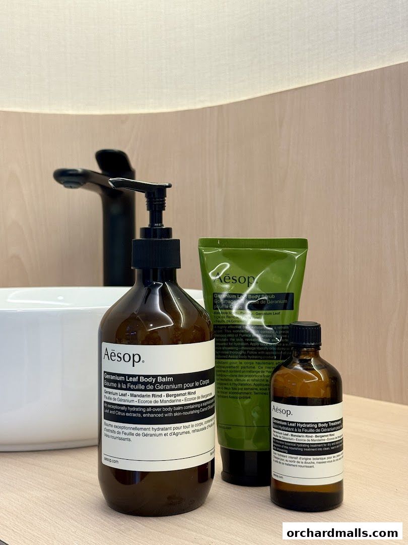 Aesop products including body balm, body scrub, and hydrating treatment.