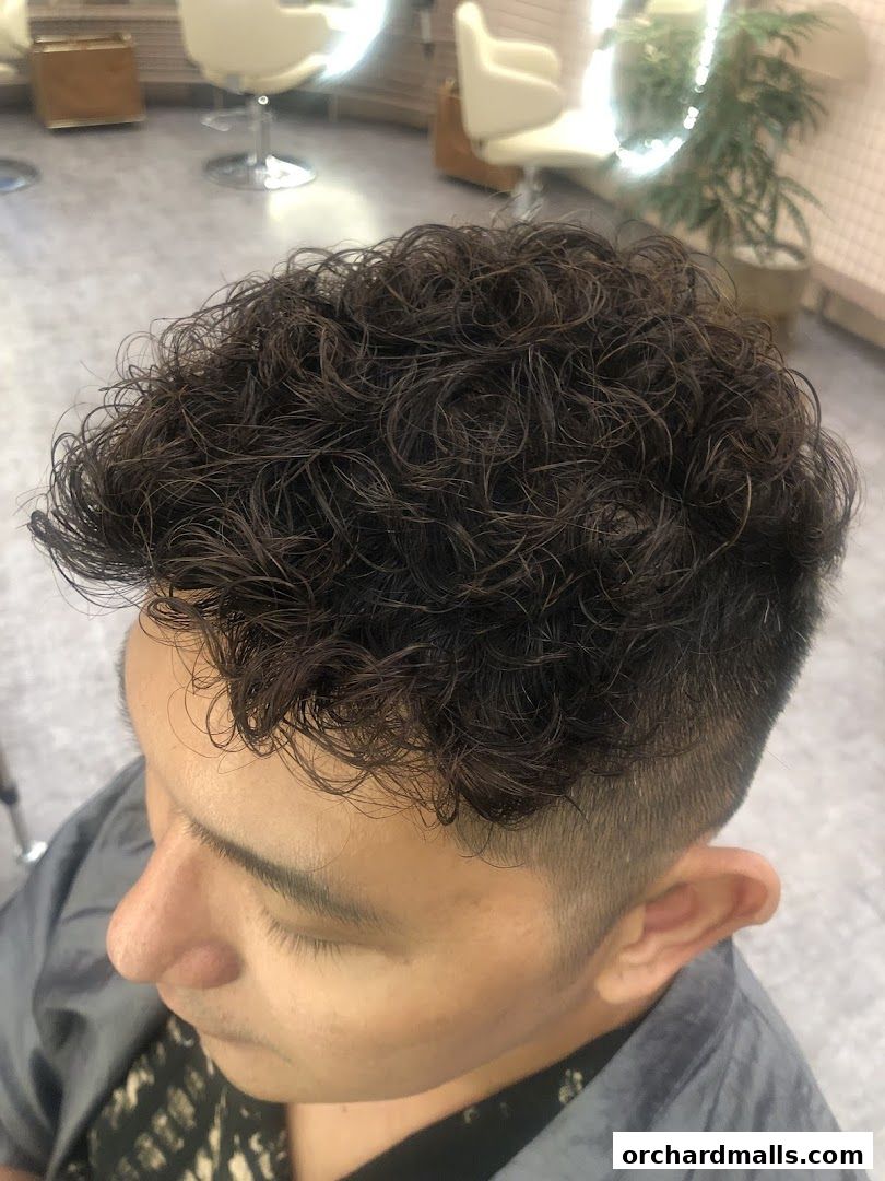 Close-up of a man's curly hair after a treatment at TrichoLab.