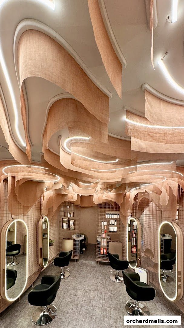 Interior of a luxurious hair growth and scalp treatment salon with modern styling chairs and unique ceiling decor.