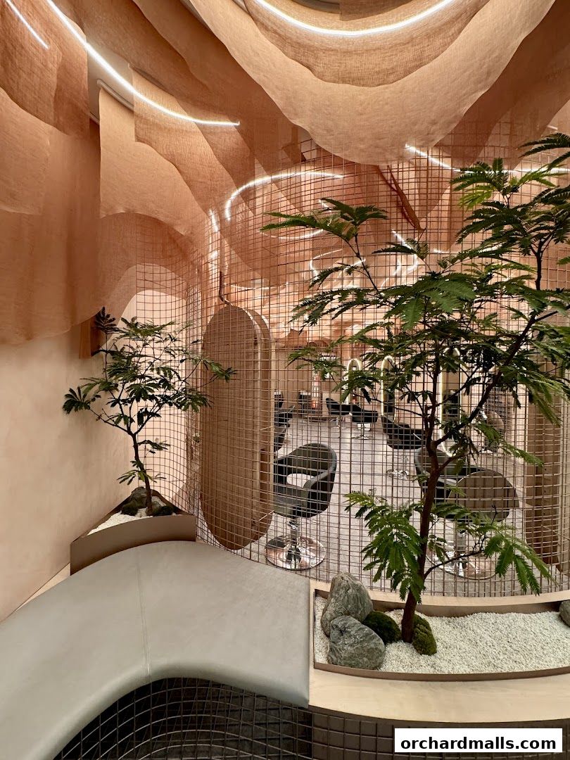 Interior of a luxurious hair growth and scalp treatment salon with modern decor and plants.