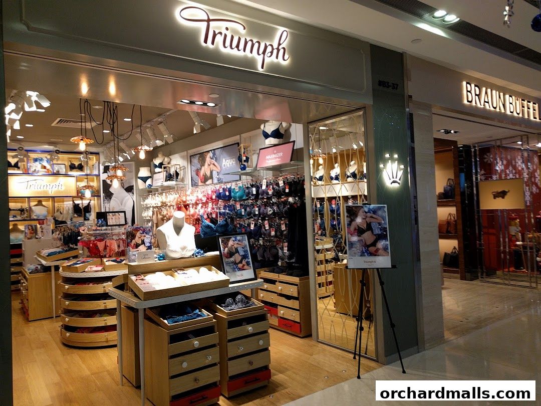 The interior of a Triumph lingerie shop, showcasing bras and other intimate apparel on display.
