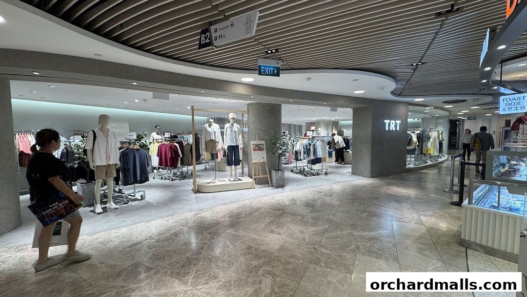 Interior view of TRT - The Restyle Trait clothing store with mannequins and apparel displays.