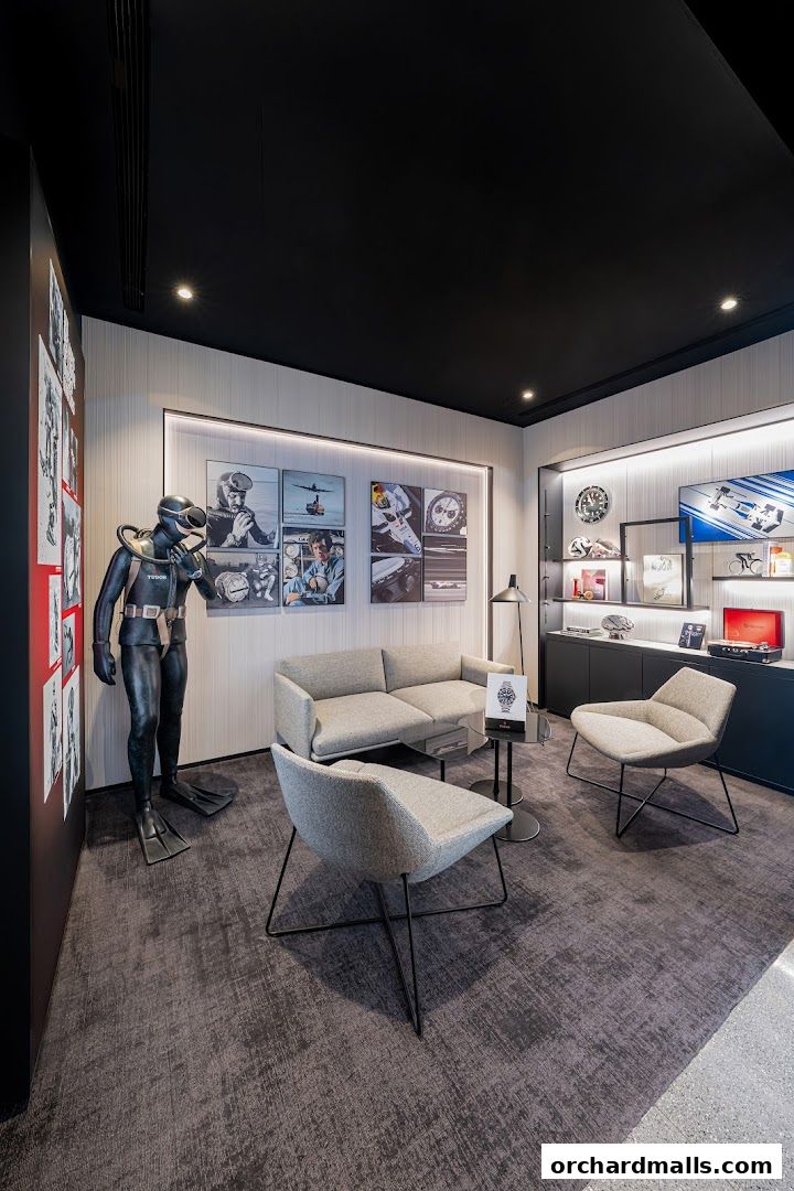 Interior of a luxury watch boutique with seating and display cases.