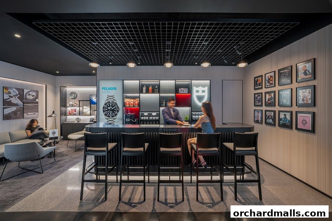 Interior of a modern Tudor Boutique with a bar, seating area, and watch displays.