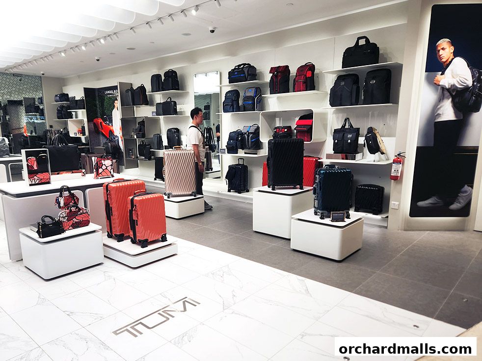 Interior of a TUMI store showcasing a wide selection of luggage and bags.