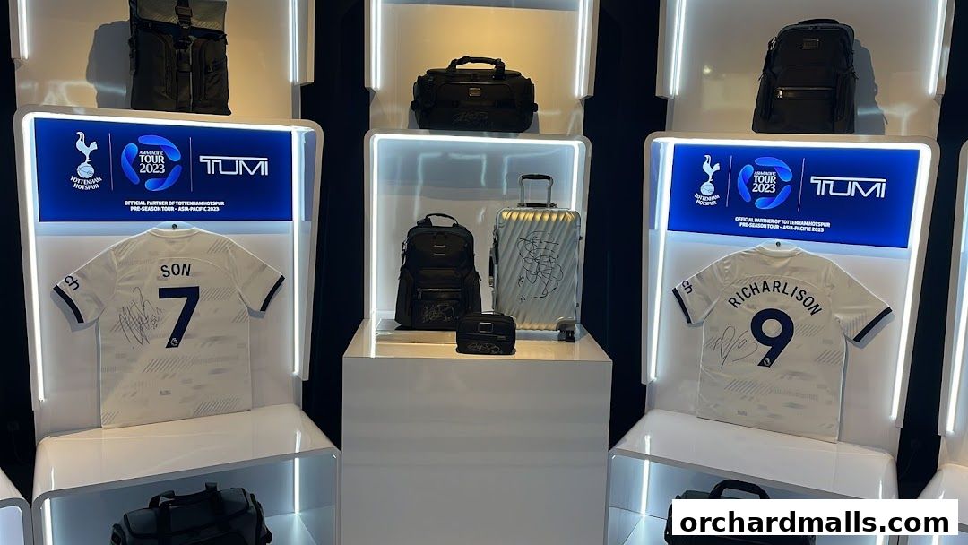 TUMI store display featuring Tottenham Hotspur jerseys and travel bags.