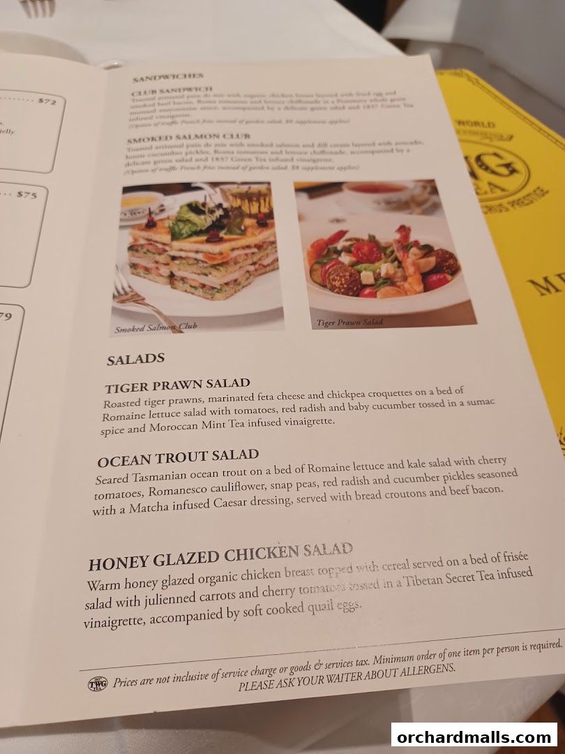 A menu from TWG Tea featuring sandwiches and salads with enticing descriptions.
