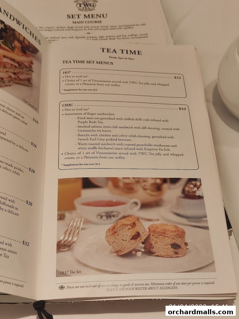 A menu from TWG Tea featuring tea time set menus with descriptions and prices.