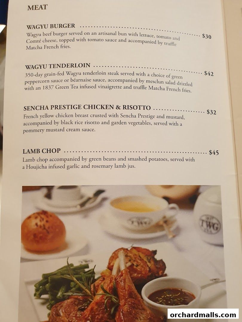 A menu page from TWG Tea featuring meat dishes like Wagyu Burger and Lamb Chop.