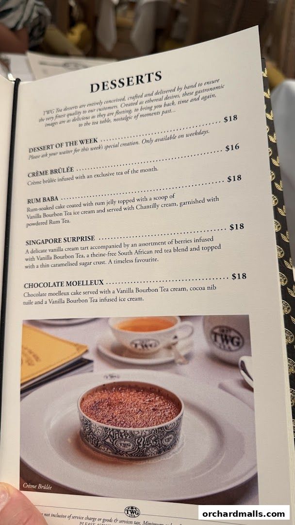 A menu page from TWG Tea featuring desserts with descriptions and prices.