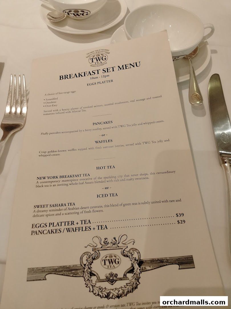 A breakfast set menu from TWG Tea, featuring eggs, pancakes, waffles, and tea options.