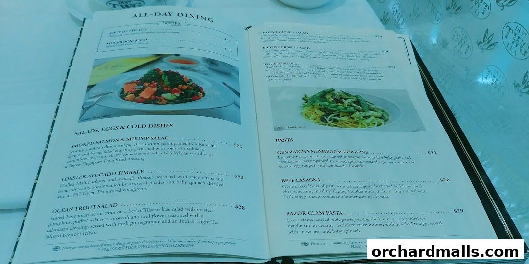A menu from TWG Tea featuring salads, pasta, and soups with accompanying images.