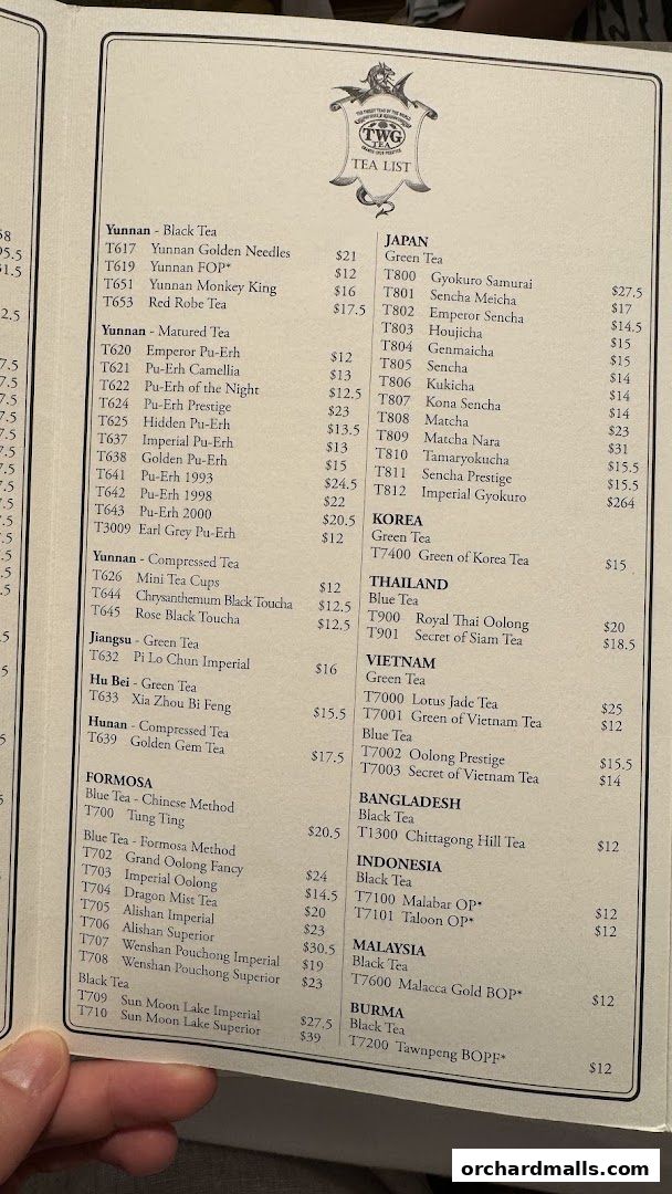 A tea list from TWG Tea, featuring teas from various regions with prices.