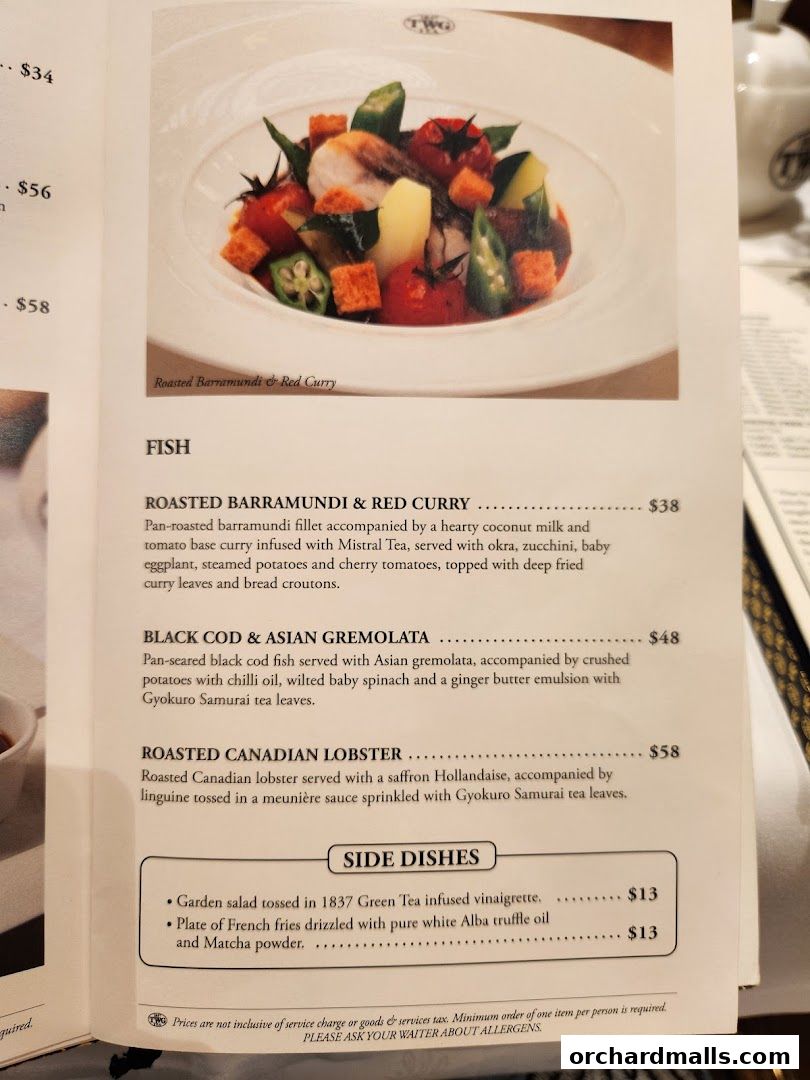 A menu page from TWG Tea featuring fish dishes and side dishes with prices.