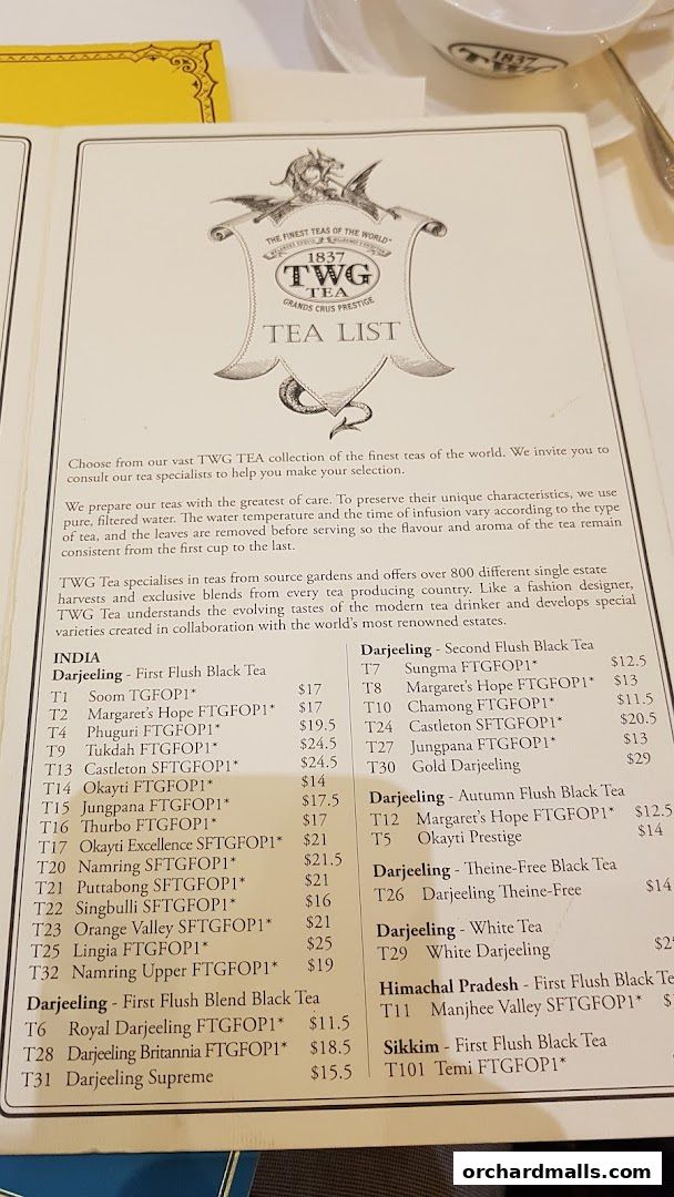 A tea list from TWG Tea featuring various Darjeeling and other regional teas with prices.