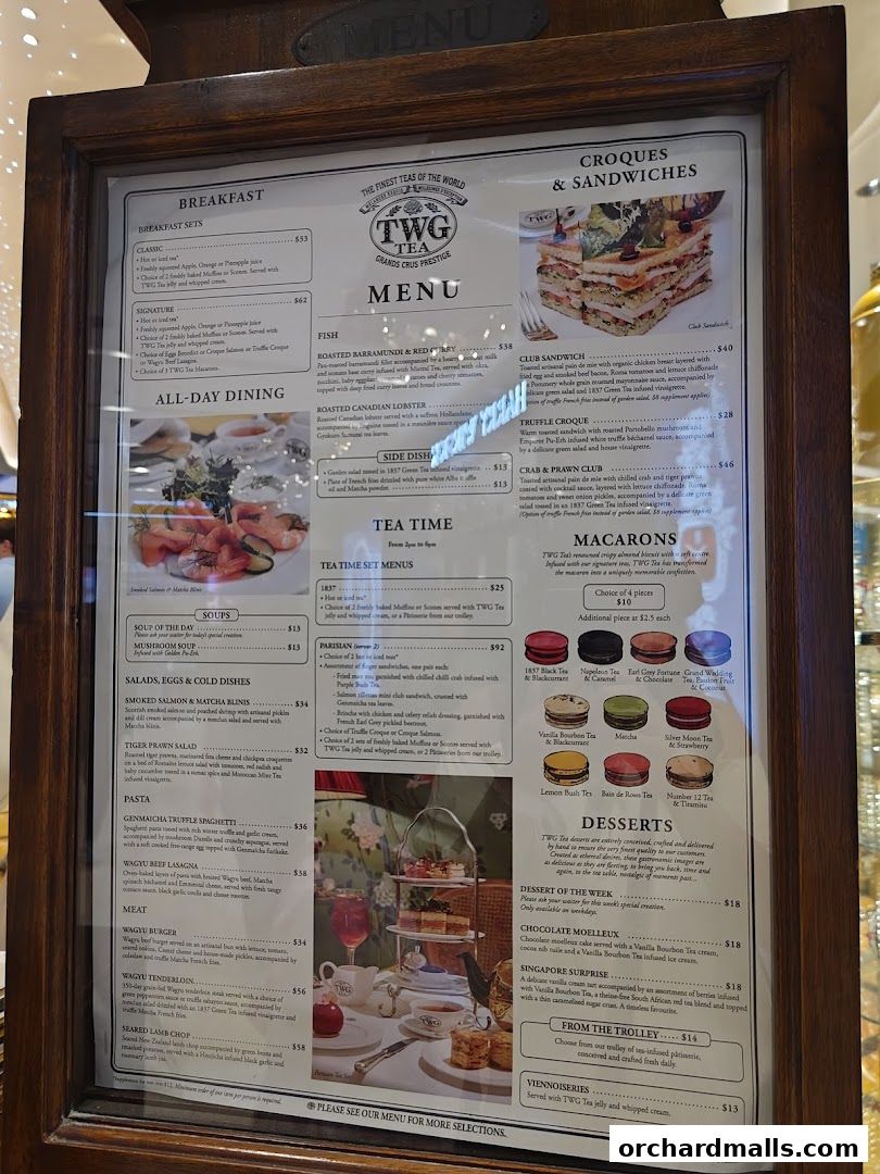 A framed menu from TWG Tea, showcasing breakfast, lunch, and dessert options.