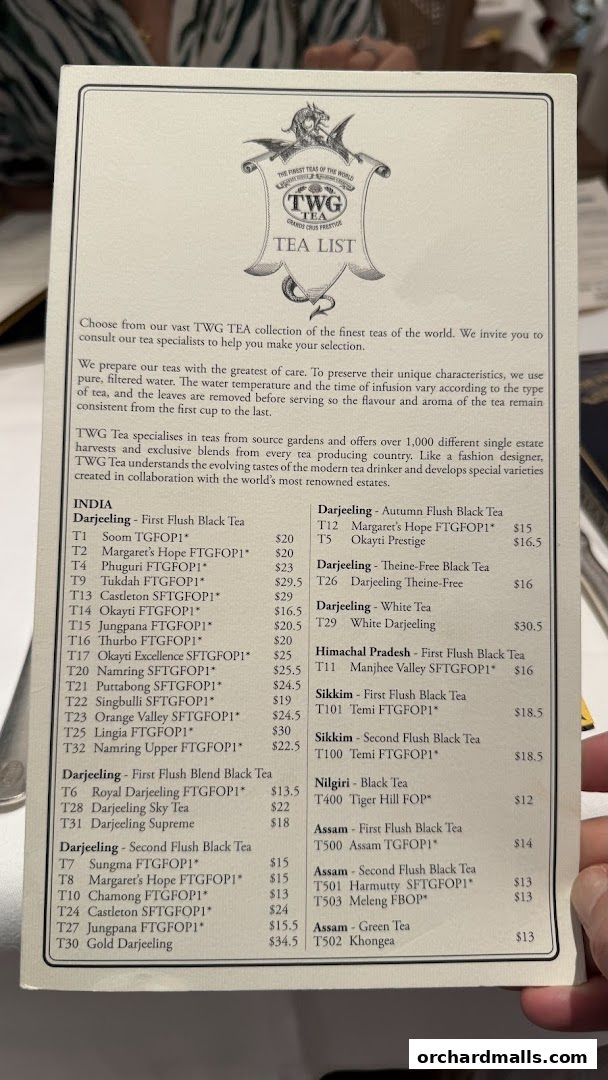 A tea list from TWG Tea featuring various Darjeeling, Assam, Nilgiri, and Sikkim teas with prices.