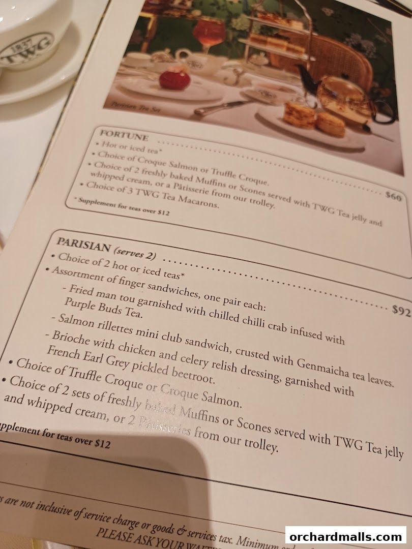 A menu from TWG Tea at ION Orchard, featuring tea sets and pastries.
