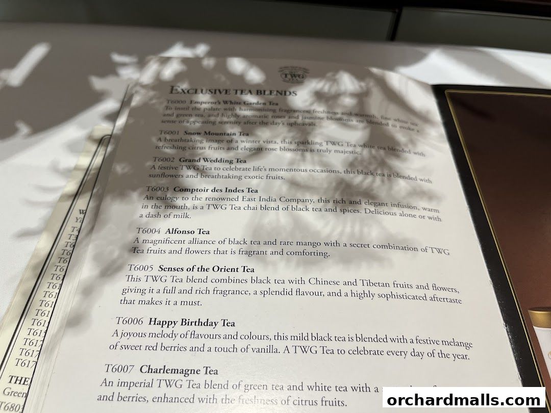 A menu showcasing exclusive TWG Tea blends with detailed descriptions.
