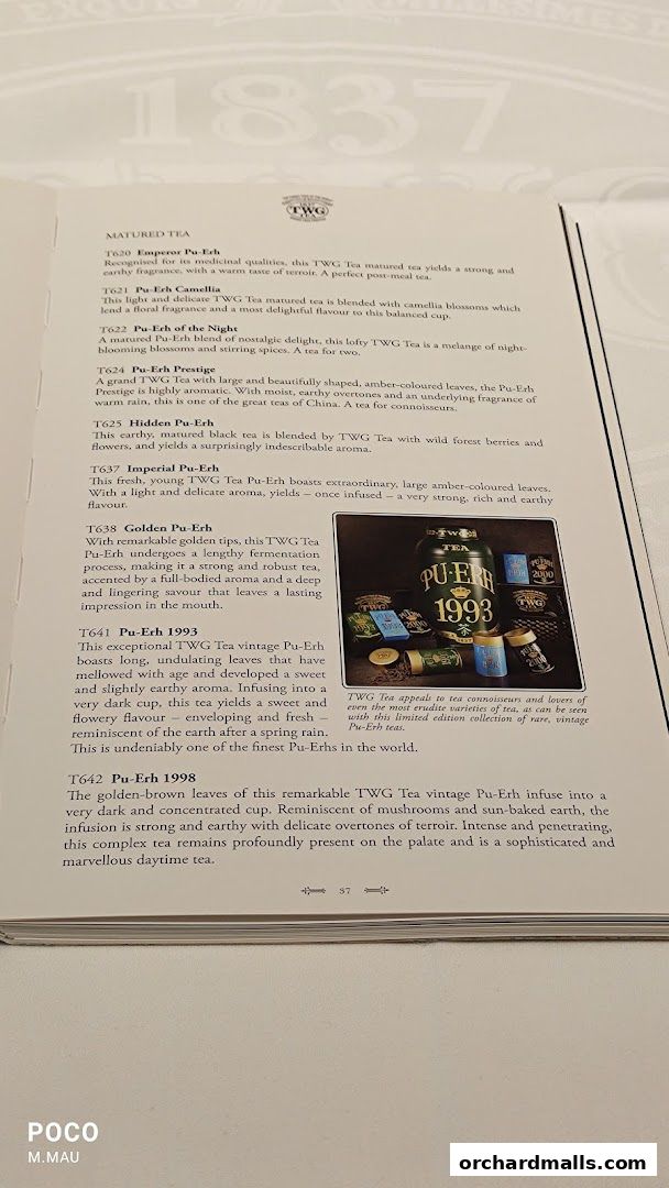A menu page from TWG Tea featuring various Pu-Erh teas with descriptions.