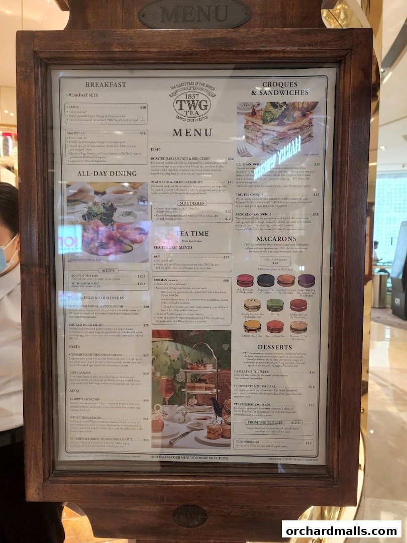 A menu board for TWG Tea, featuring breakfast, lunch, tea, and dessert options.