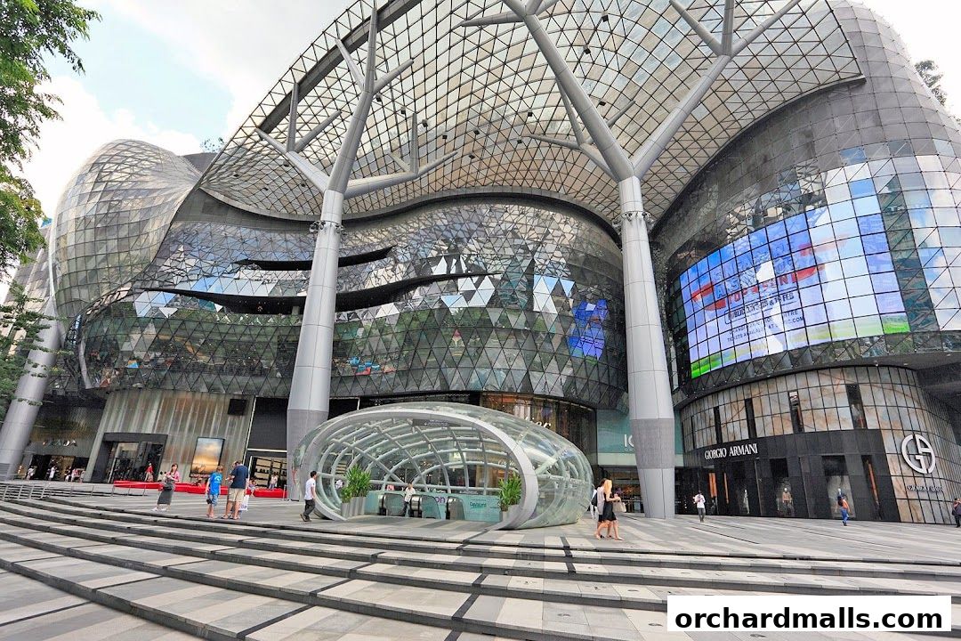 Exterior view of the ION Orchard shopping mall with its distinctive glass facade and entrance.