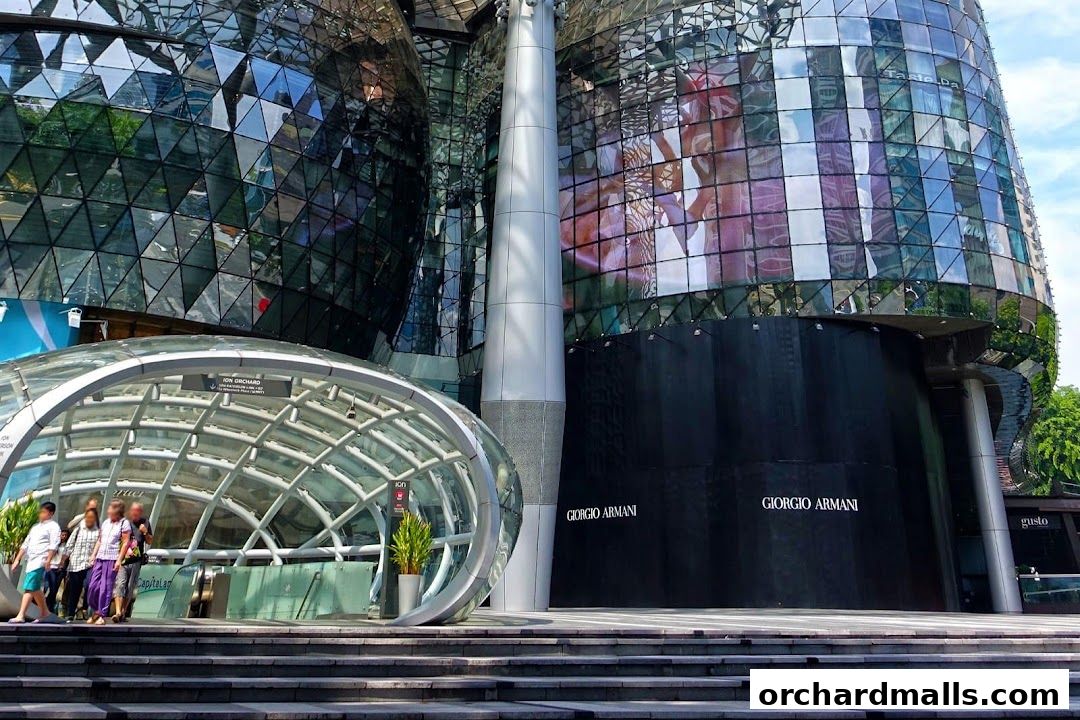 The striking modern architecture of ION Orchard mall with its glass facade and entrance.