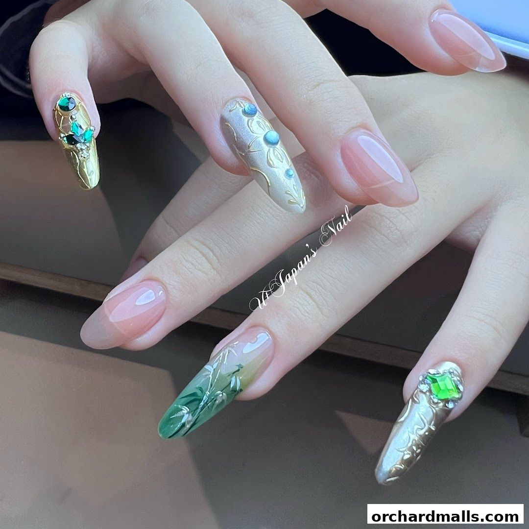Close-up of hands with elaborate, artistic nail designs featuring gems and intricate patterns.