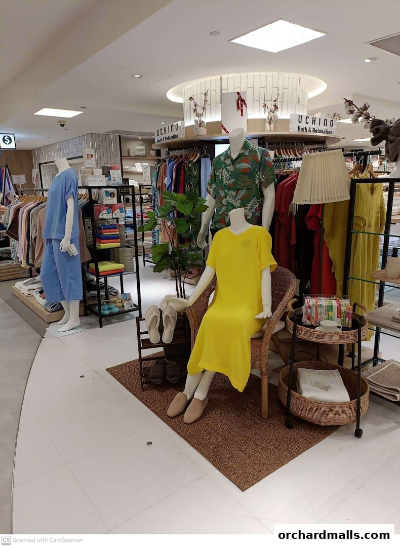 Mannequins display loungewear and accessories in a retail store.