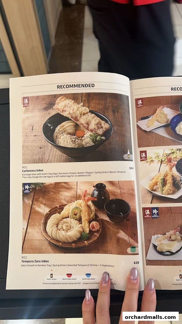 A menu from Udon Shin Singapore featuring recommended udon dishes like Carbonara Udon and Tempura Zaru Udon.