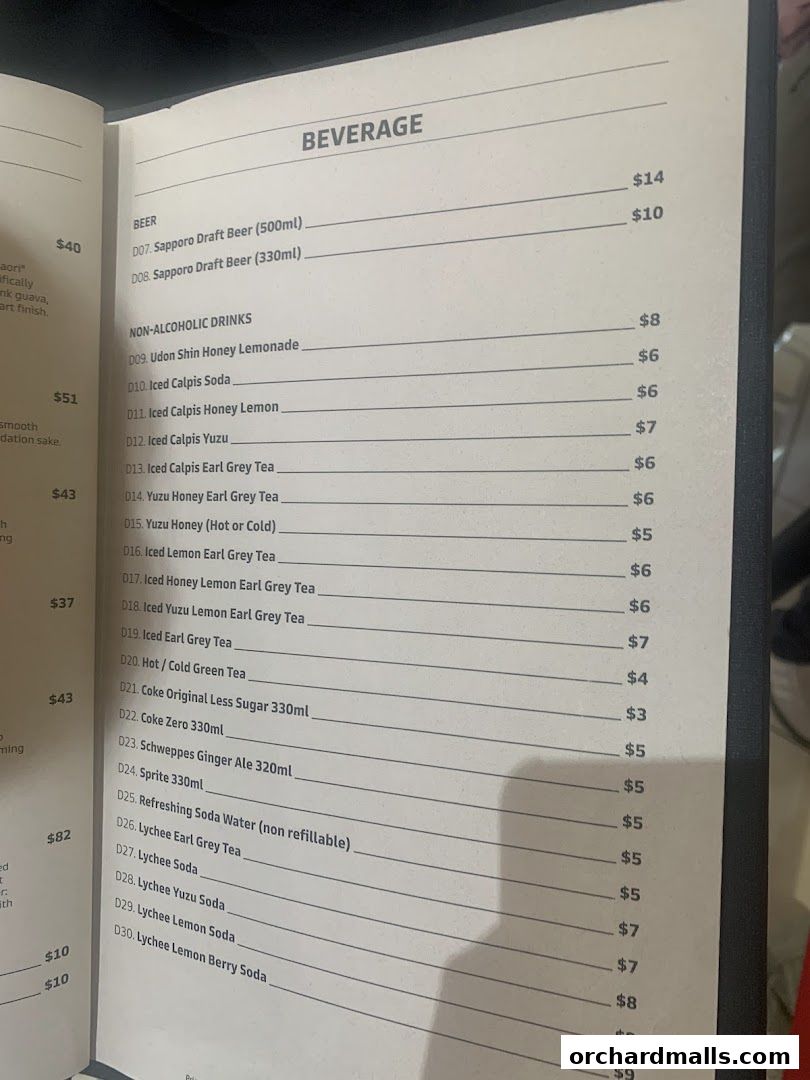A menu page from Udon Shin Singapore featuring beverages like beer and non-alcoholic drinks.