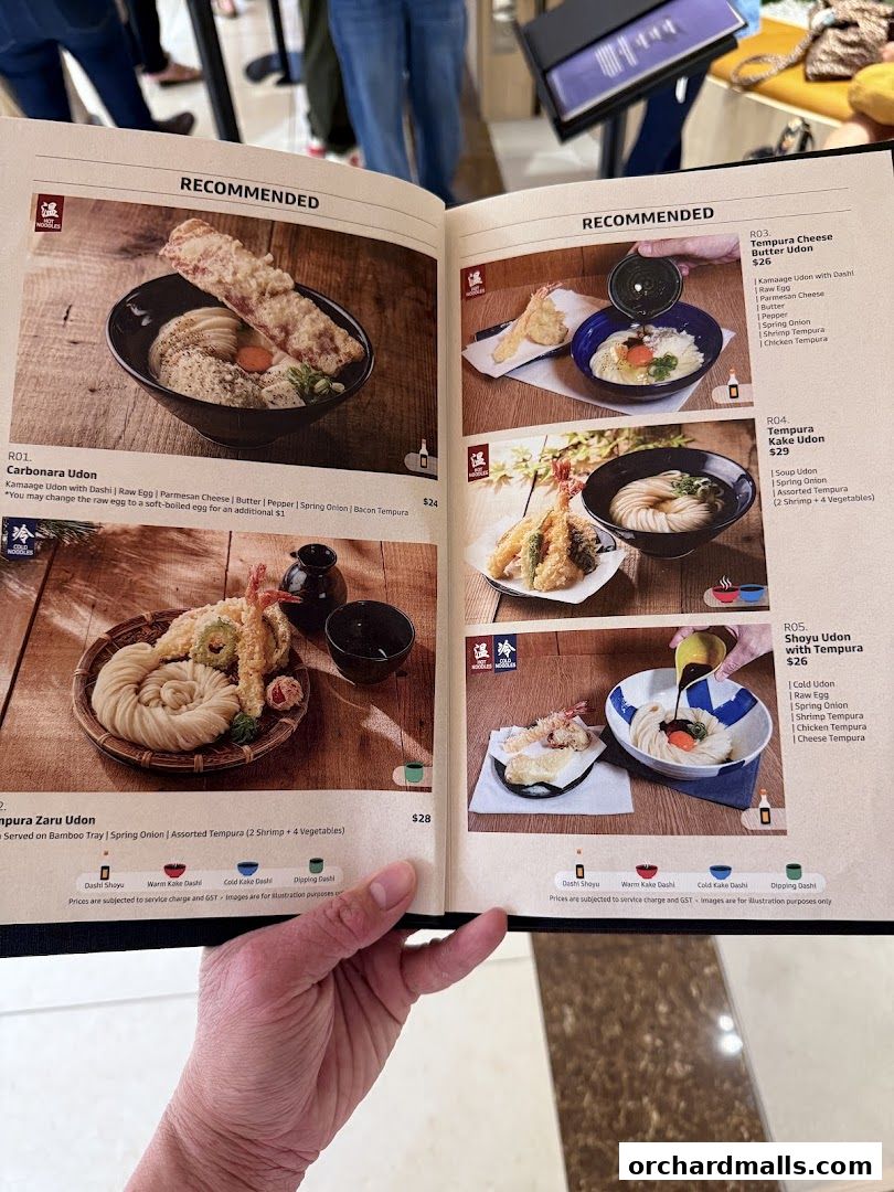 A menu from Udon Shin Singapore showcasing recommended udon dishes with tempura.