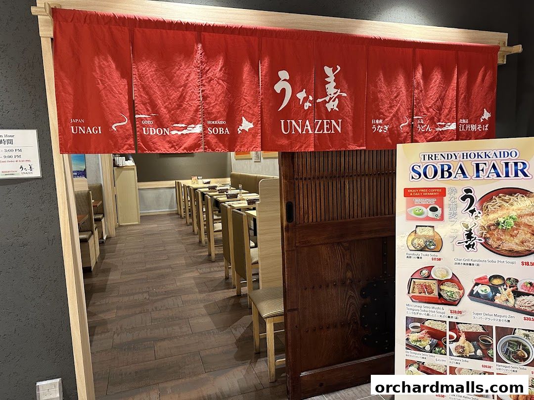 Entrance to Unazen restaurant with red noren curtains and a menu board.