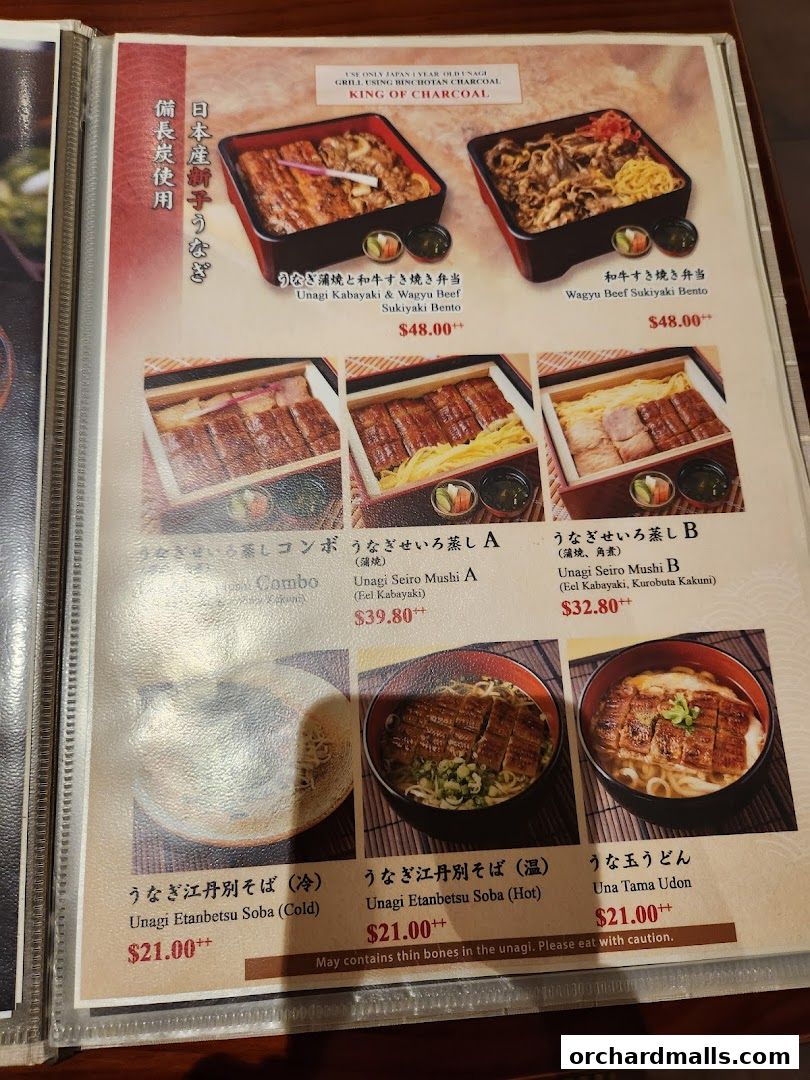 A menu page showcasing various Japanese eel and beef dishes, including bentos, soba, and udon.