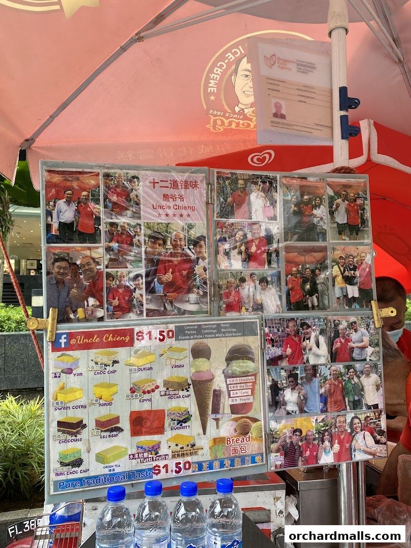 A display board for Uncle Chieng Traditional Wafer Ice Cream with photos and menu items.