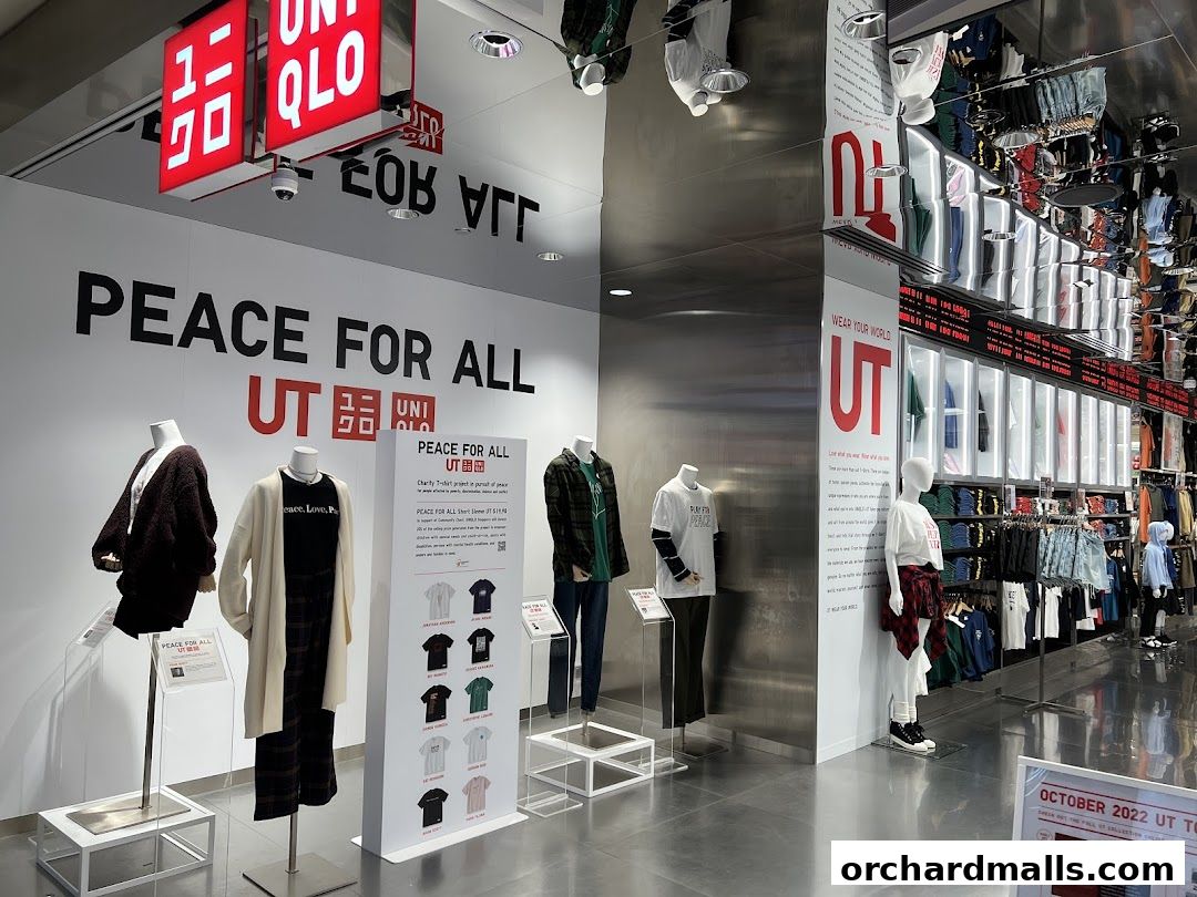 Interior view of a UNIQLO store showcasing the 'PEACE FOR ALL' UT collection with mannequins and clothing displays.