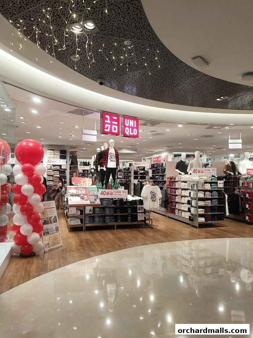 Interior view of a UNIQLO store with clothing displays and mannequins.