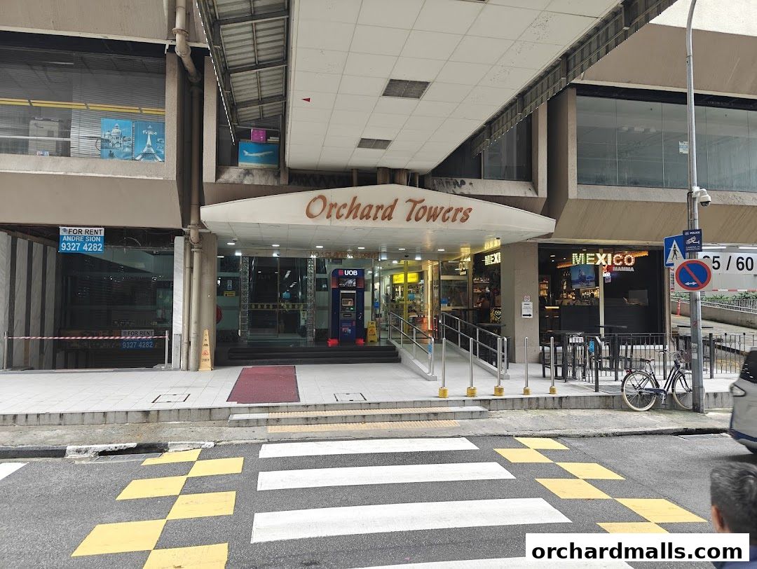 The entrance to Orchard Towers, featuring a UOB ATM and a bar called Mexico.