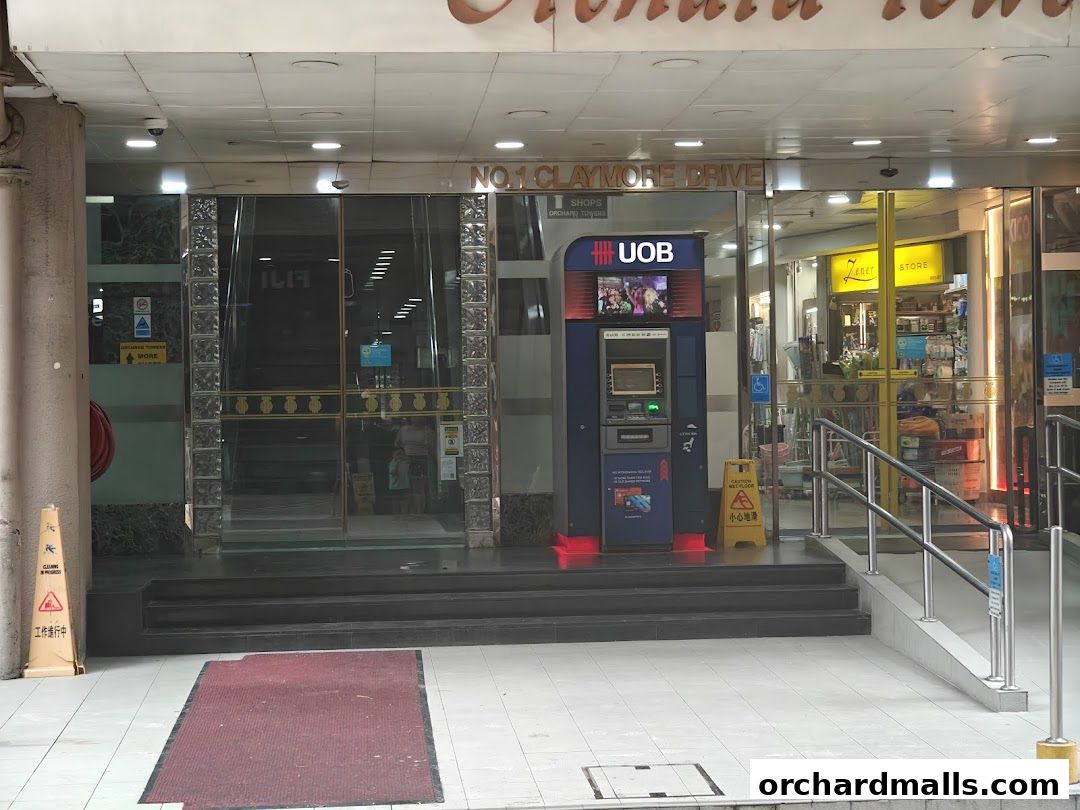 UOB ATM located at Orchard Tower, with shops visible in the background.
