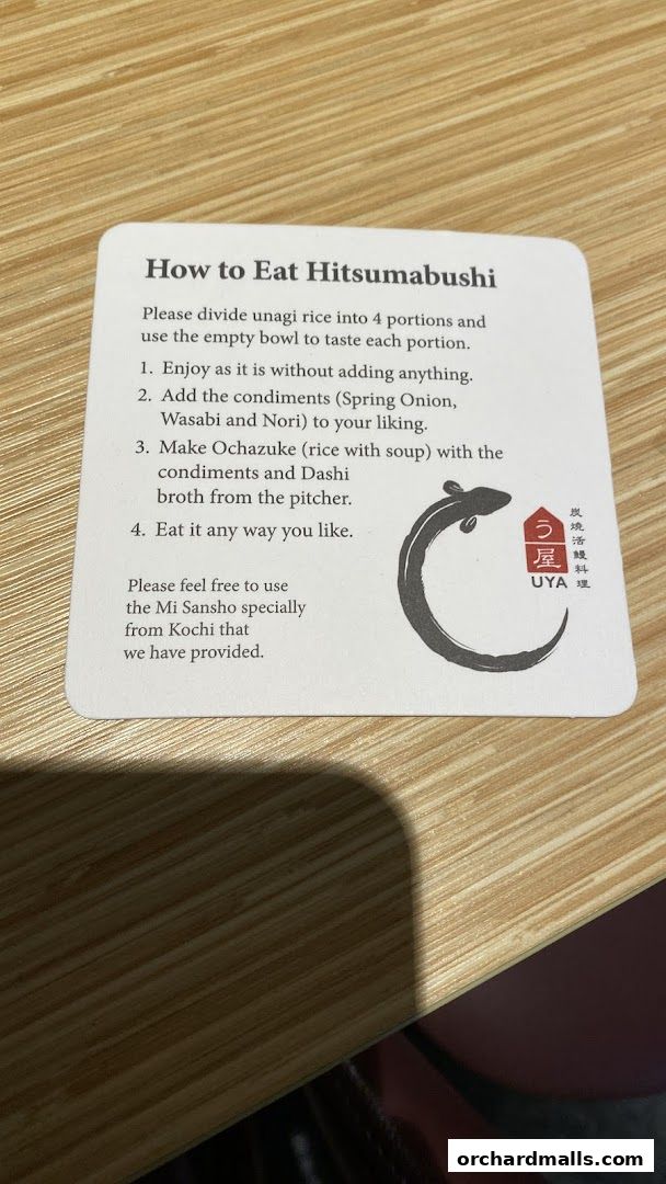 A card explaining how to eat Hitsumabushi with UYA Unagi Singapore branding.