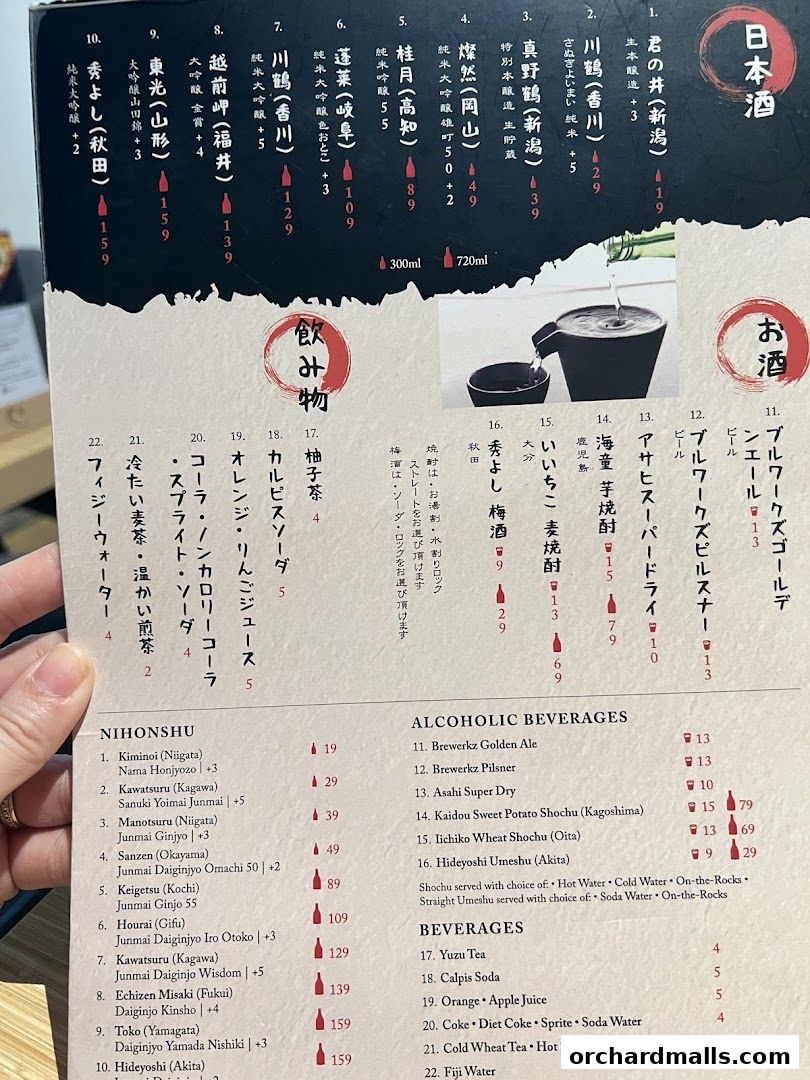 A menu featuring Japanese sake, alcoholic beverages, and other drinks with prices.