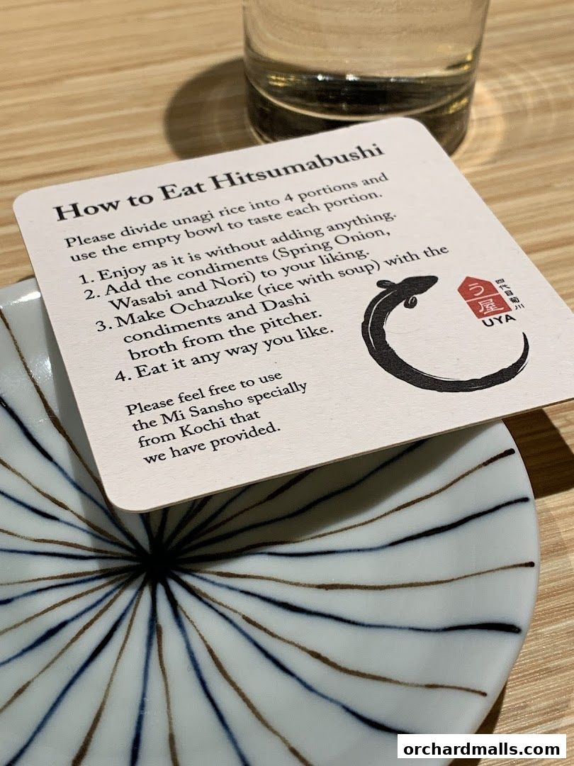A card explaining how to eat Hitsumabushi with a glass and a plate.