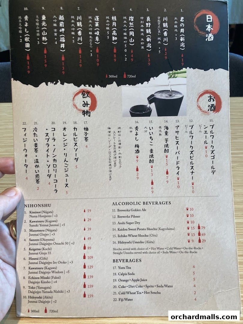 A menu featuring Japanese sake, alcoholic beverages, and other drinks with prices.