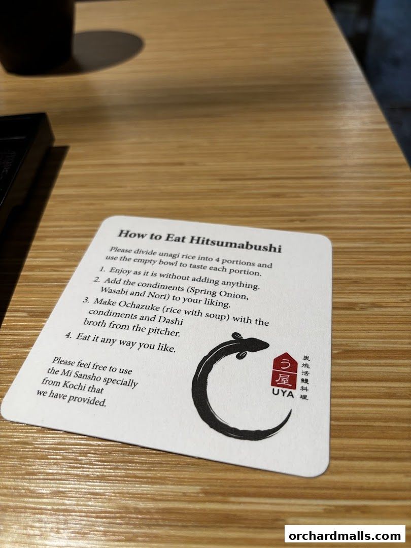 A card explaining how to eat Hitsumabushi at UYA Unagi Singapore.