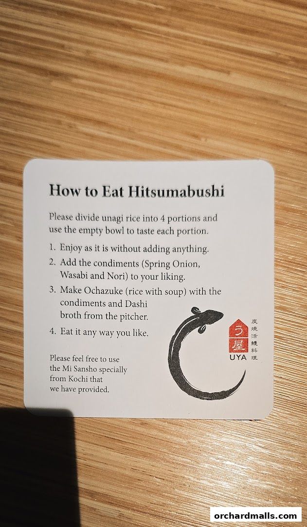 A card explaining how to eat Hitsumabushi with UYA Unagi Singapore branding.